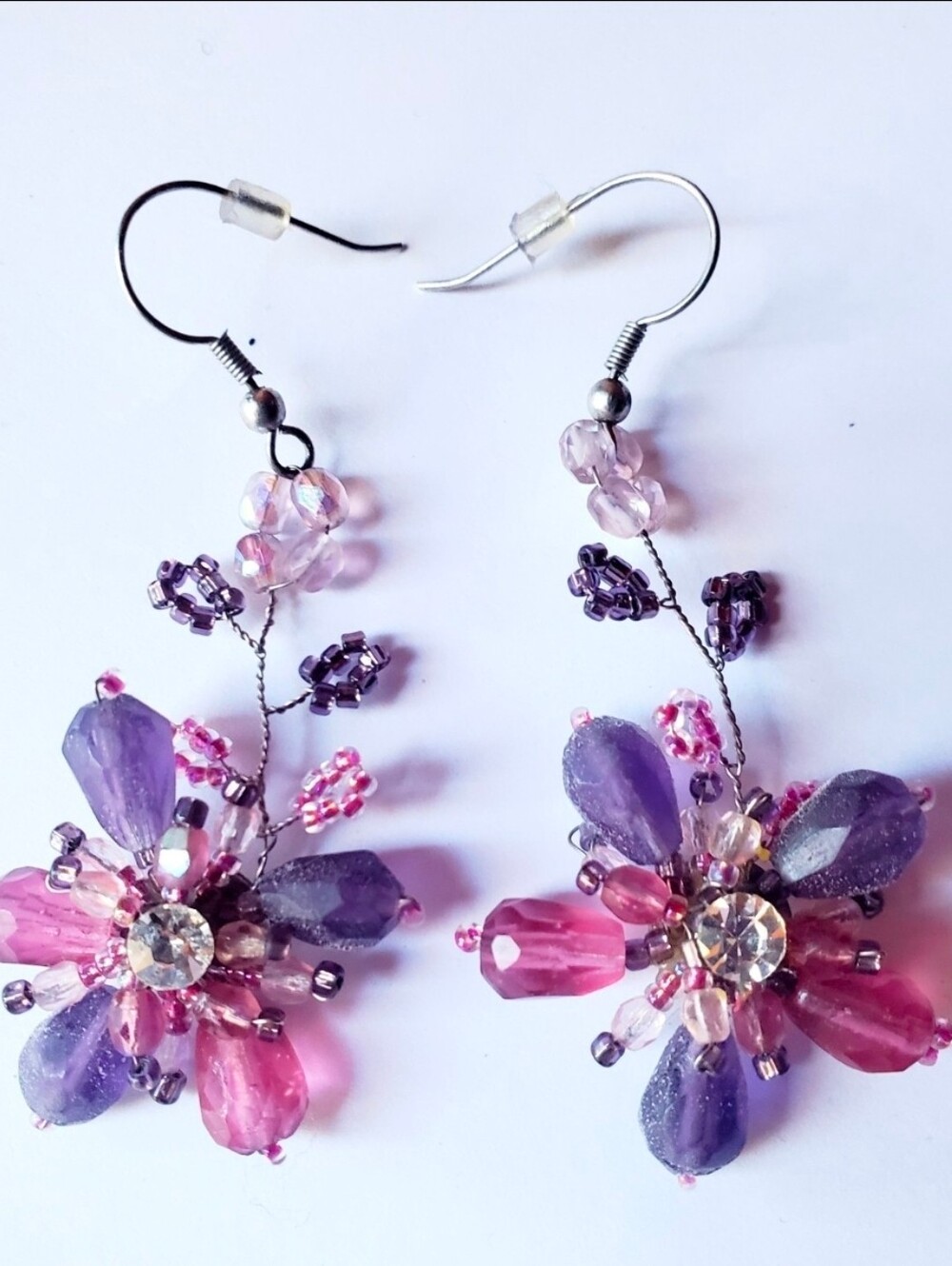 Crystal floral earrings on a wire drop.